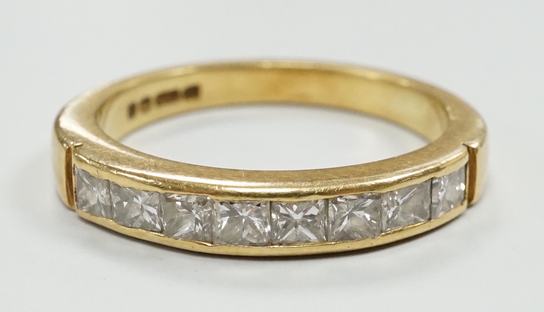 A modern 18ct gold and eight stone princess? cut diamond set half hoop ring, size M/N, gross weight 3.8 grams.